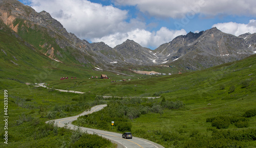 landscape leading to mountains and blue skies