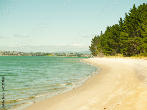 Scenic beach leading along harbor edge