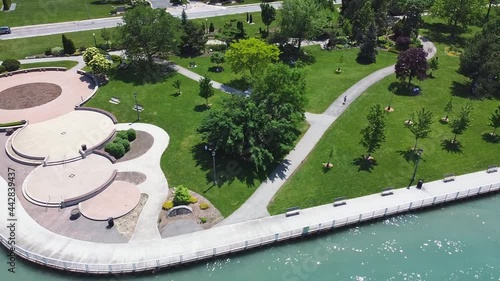 Drone flyover of a beautiful park greenspace by the water photo