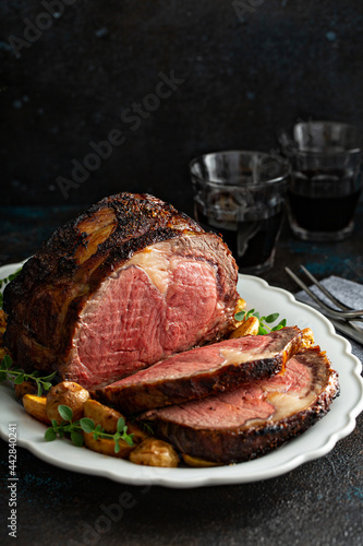 Фототапет Prime rib roast sliced for celebration dinner