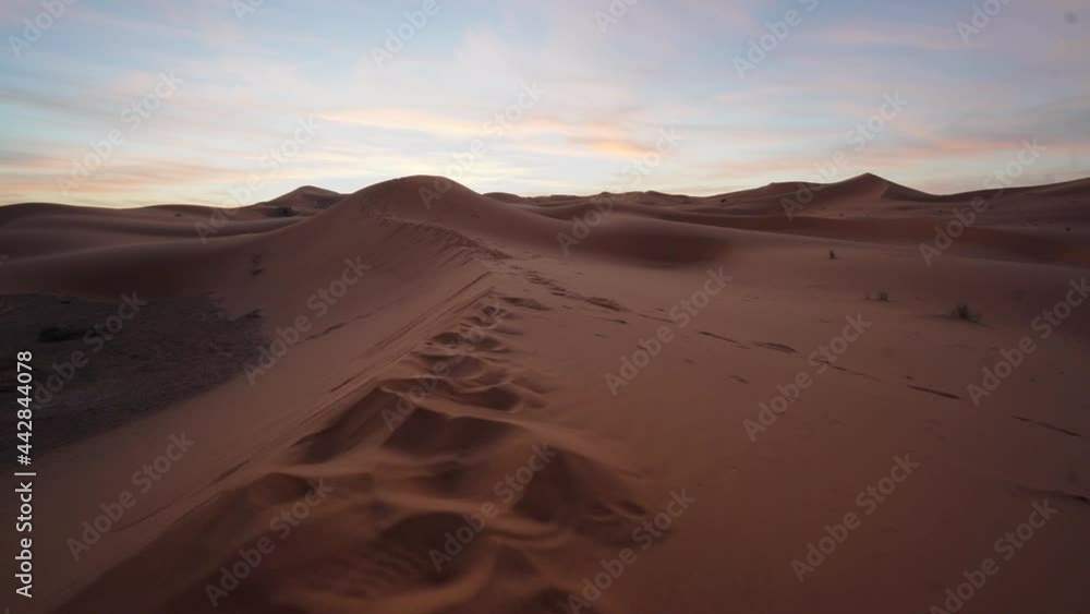 Aerial View Of Sahara Desert Sand Dunes At Sunrise. With Footprints In It Aerial View Of Sahara Desert Sand Dunes At Sunrise. With Footprints In It