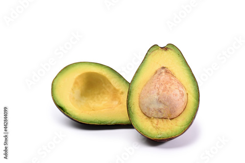 Half avocado isolated on white background.