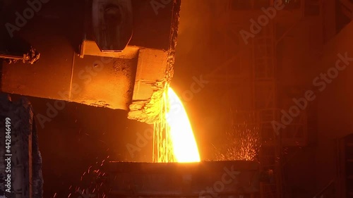 Tank pours liquid metal at the steel mill. Liquid metal from blast furnace. Steel production in a steelmaking furnace. Tank pours liquid metal at the steel mill
