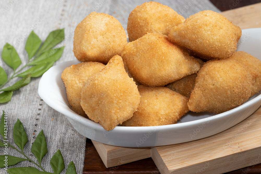 A portion of Brazilian snack coxinha of chicken. A portion of Brazilian snack coxinha of chicken.
