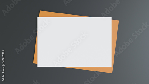 Blank white paper on the brown paper envelope. Mock-up of horizontal blank greeting card. Top view of Craft paper envelope on black background. Flat lay of stationery. Minimalism style. 3D Rendering.