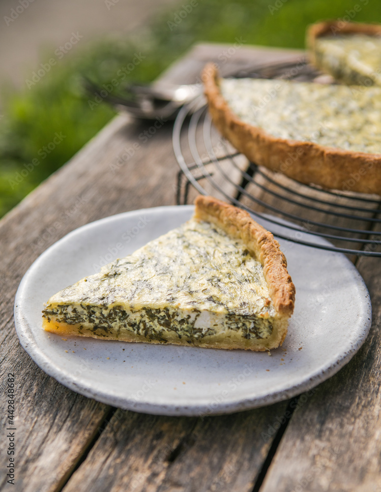 Quiche with spinach - traditional dish of french cuisine. Spinach tart Quiche with spinach - traditional dish of french cuisine. Spinach tart