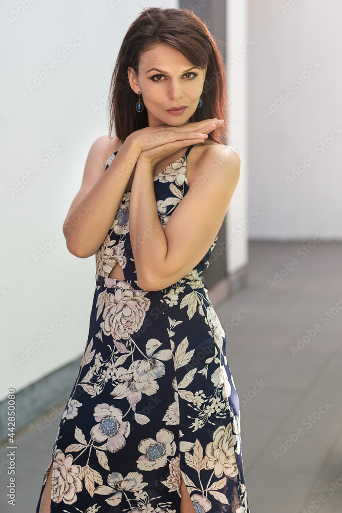 Portrait of an attractive mature female model posing against a white background. Portrait of an attractive mature female model posing against a white background.