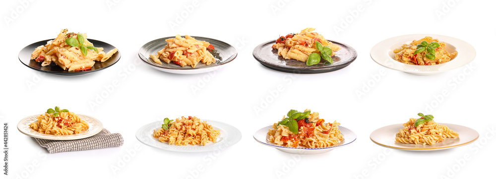 Plates with tasty pasta, tomatoes and feta cheese on white background Plates with tasty pasta, tomatoes and feta cheese on white background