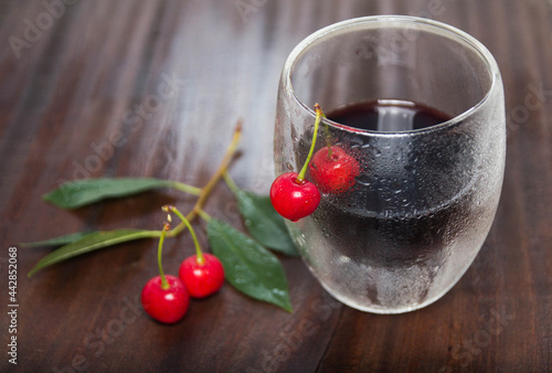 Wallpaper Mural cherry juice.cherry wine a steamed glass on the table with ripe cherry berries Torontodigital.ca