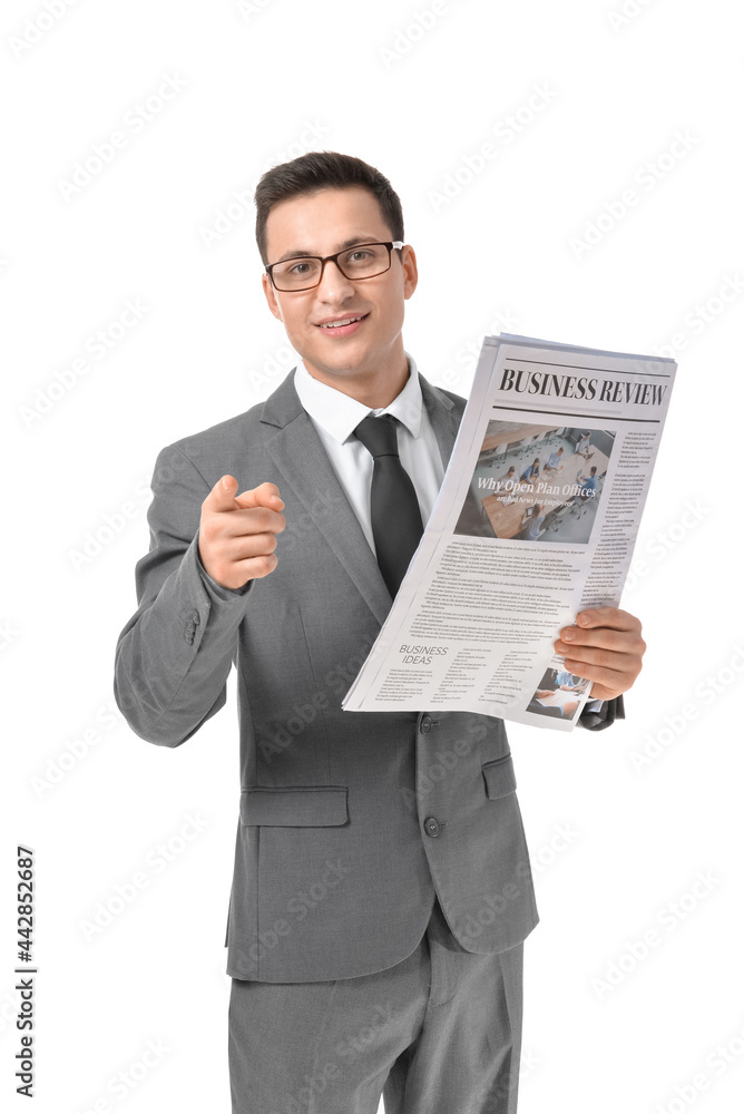 Young businessman with newspaper pointing at viewer on white background Young businessman with newspaper pointing at viewer on white background