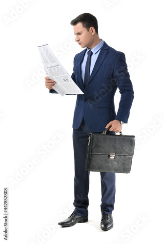 Young businessman reading n...