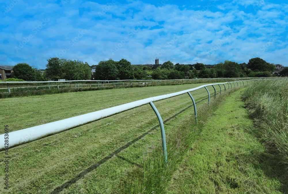 The is Warwick racecourse for steeplechase national hunt fence and hurdles horse racing. On a public park. Warwickshire. England UK. The is Warwick racecourse for steeplechase national hunt fence and hurdles horse racing. On a public park. Warwickshire. England UK.
