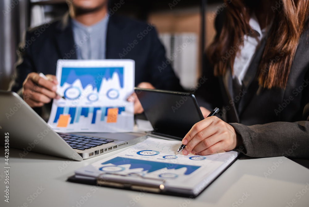 Businessman and team analyzing financial statement Finance task. with smart phone and laptop and tablet. Wealth management Businessman and team analyzing financial statement Finance task. with smart phone and laptop and tablet. Wealth management