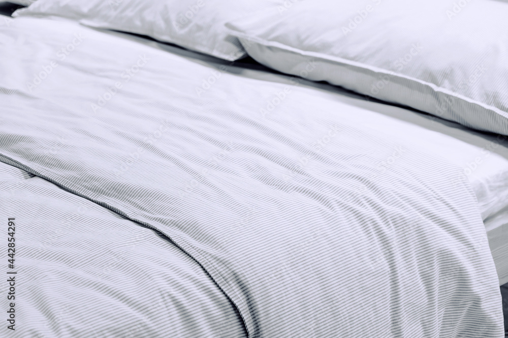 Close up image of Bed mattress Duvet with pillow and blanket Top view
