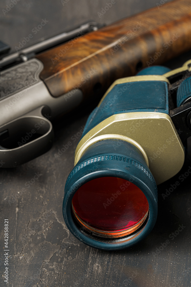 Hunting binoculars with red lense, close up Hunting binoculars with red lense, close up