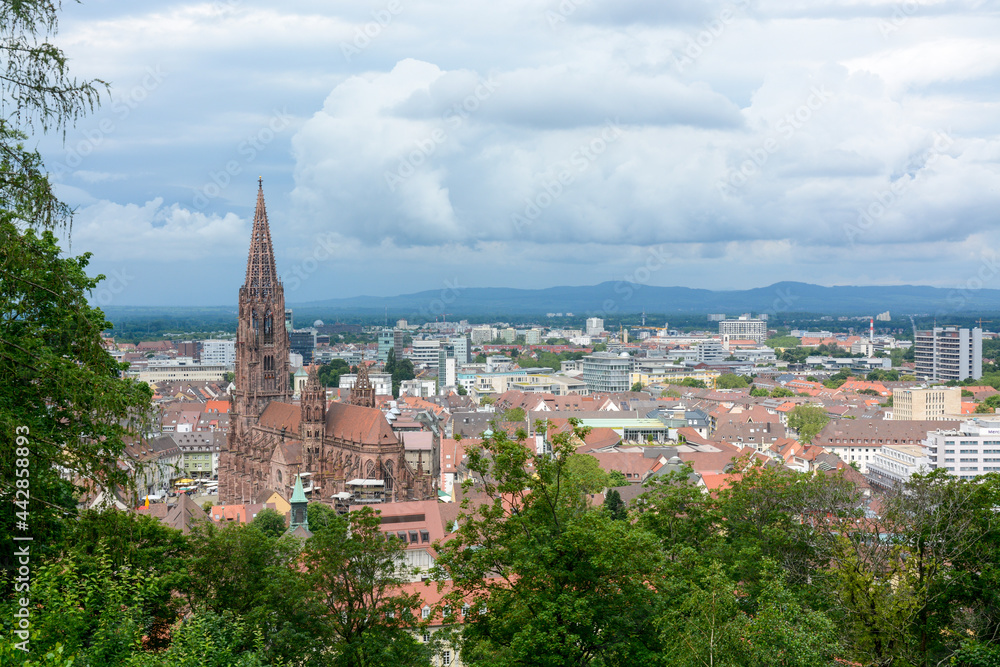 Freiburg im Breisgau, June 29, 2021: A storm front forms over the Rhine Valley and the city of Freiburg with the minster over the roofs of the old town.