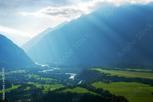 Soča river valley in Slovenian Alps. Sun rays