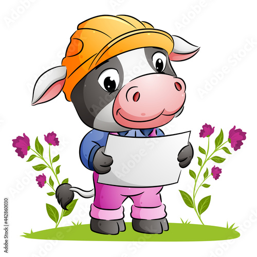 The cute architect cow is holding a paper plan and using a safety helmet