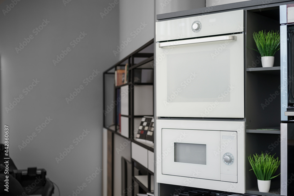 Fototapeta premium Electrical ovens, home appliances in the store..