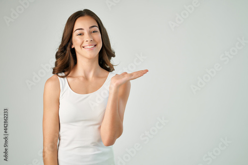 cute brunette in white t shirt smile hand gesture lifestyle