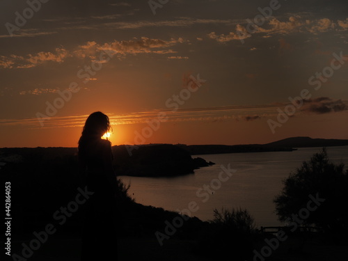 silhouette of a young woman in Menorca 