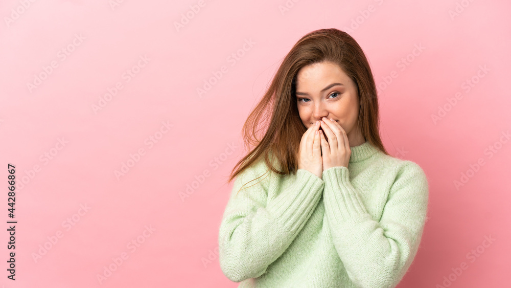 Teenager girl over isolated pink background happy and smiling covering mouth with hands Teenager girl over isolated pink background happy and smiling covering mouth with hands