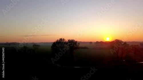 Wallpaper Mural Aerial Cinematic clip,Drone flying over a farm field during sunset. Drone flies over green agriculture wheat field. Beautiful summer landscape of a wheat field. Top view to the farm wheatfield. Torontodigital.ca