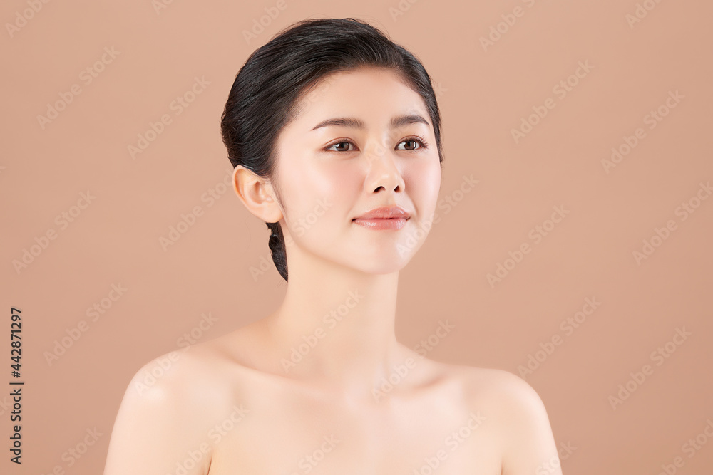 Beautiful young asian woman with clean fresh skin on beige background, Face care, Facial treatment, Cosmetology, beauty and spa, Asian women portrait. Beautiful young asian woman with clean fresh skin on beige background, Face care, Facial treatment, Cosmetology, beauty and spa, Asian women portrait.