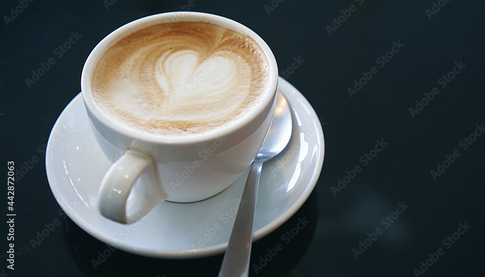 Heart froth of latte hot coffee, Love foam in a white cup, Close up Heart froth of latte hot coffee, Love foam in a white cup, Close up