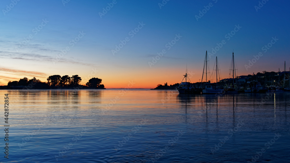 Fishing boats at sunrise in Riverton, Southland, south island, New Zealand.