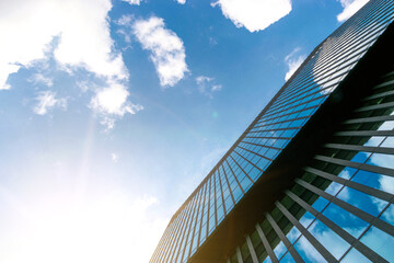 Companies buildings. Finance corporate architecture city in abstract blue sky with nature cloud in sunny day. Modern office business building with glass, steel facade exterior.