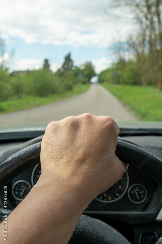 custom made wallpaper toronto digitalHand on the steering wheel while driving a car on the road
