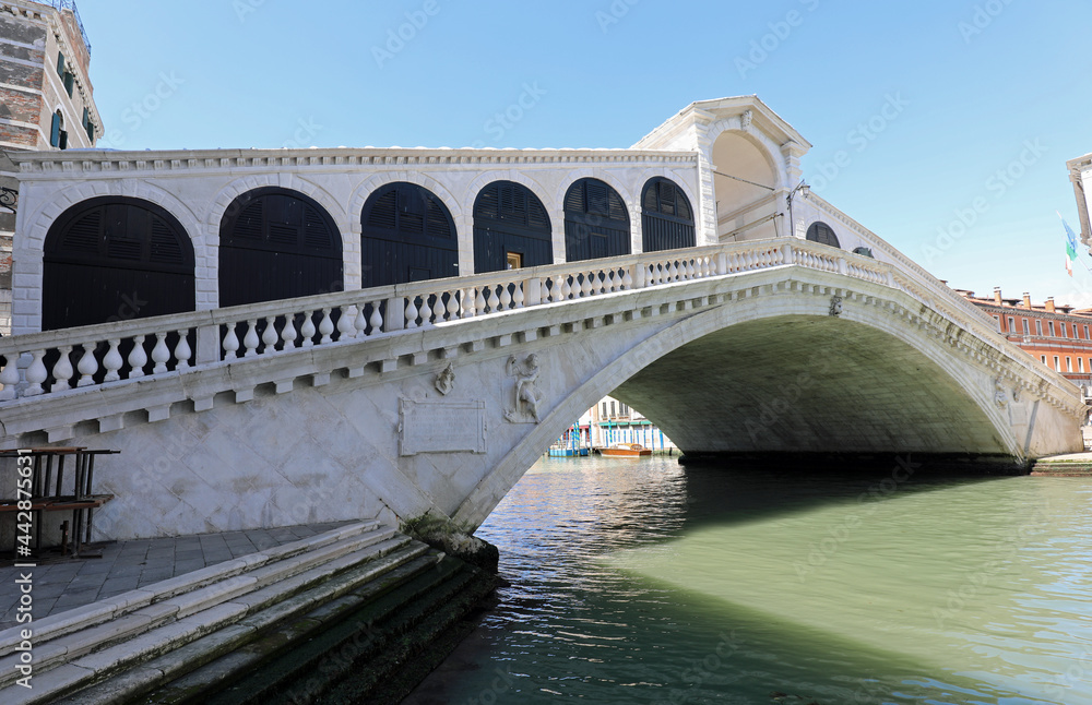 Rialto Bridge over the main Waterway in Venice called Canal Grande without people during lockdown