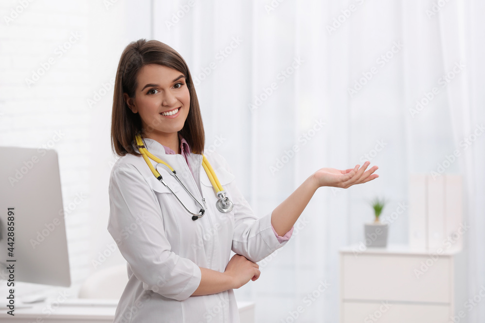 Portrait of pediatrician with stethoscope in clinic Portrait of pediatrician with stethoscope in clinic