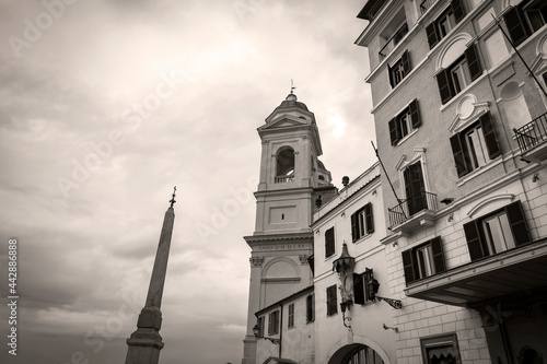 A view of The bell tower of Trinita dei Monti church and The Obelisk Sallustiano, located above the Spanish Steps in Rome, Italy photo