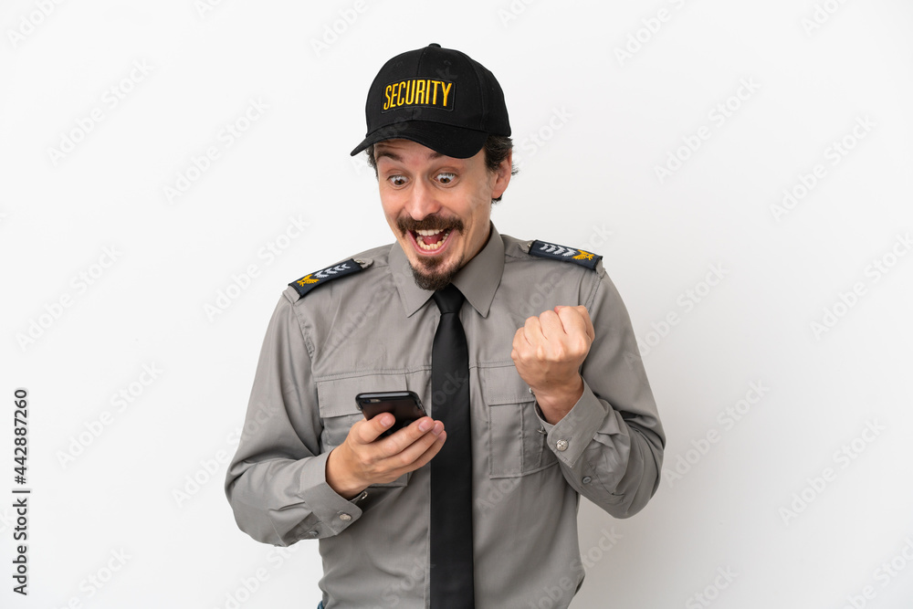 Young caucasian security man isolated on white background surprised and sending a message Young caucasian security man isolated on white background surprised and sending a message