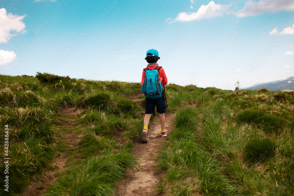 trekking in the mountains with a child