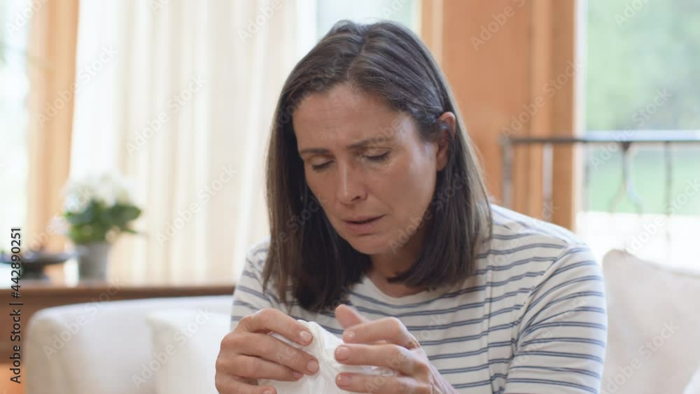 Tracking Shot Approaching Visibly Upset Woman Dabbing Eye with Tissue Tracking Shot Approaching Visibly Upset Woman Dabbing Eye with Tissue