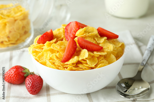 Concept of tasty breakfast with cornflakes on kitchen towel, close up