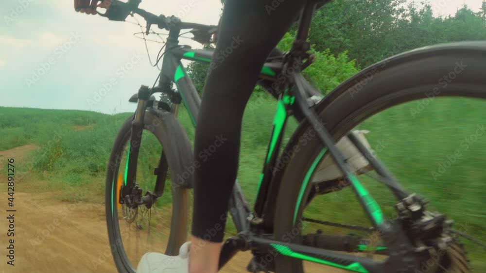rotation of the bicycle wheel. A woman pedals a bicycle, a close-up of bicycle equipment. chain and a cassette. The concept of sports. camera takes a picture of the rear wheel. rotation of the bicycle wheel. A woman pedals a bicycle, a close-up of bicycle equipment. chain and a cassette. The concept of sports. camera takes a picture of the rear wheel.