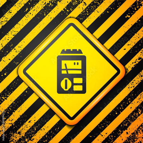 Black Dosimeter for measuring radiation icon isolated on yellow background. Gamma radiation personal dosimeter. Warning sign. Vector