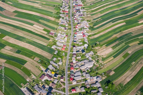 Village from drone. Suloszowa village in Krakow County, Lesser Poland Voivodeship, in southern Poland. Beautiful village with houses and fields in Poland.
