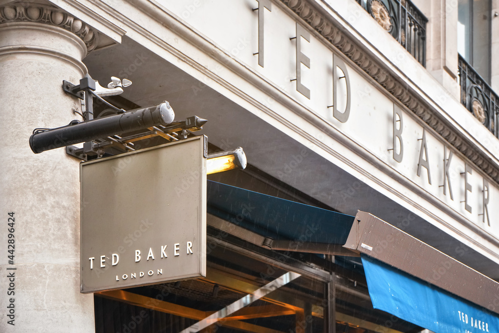 London, United Kingdom - February 01, 2019: Cloeup detail on black letters  and hanging sign on one of Ted Baker shops in central London. Tedbaker is  British luxury clothing outlet Stock Photo | Adobe Stock