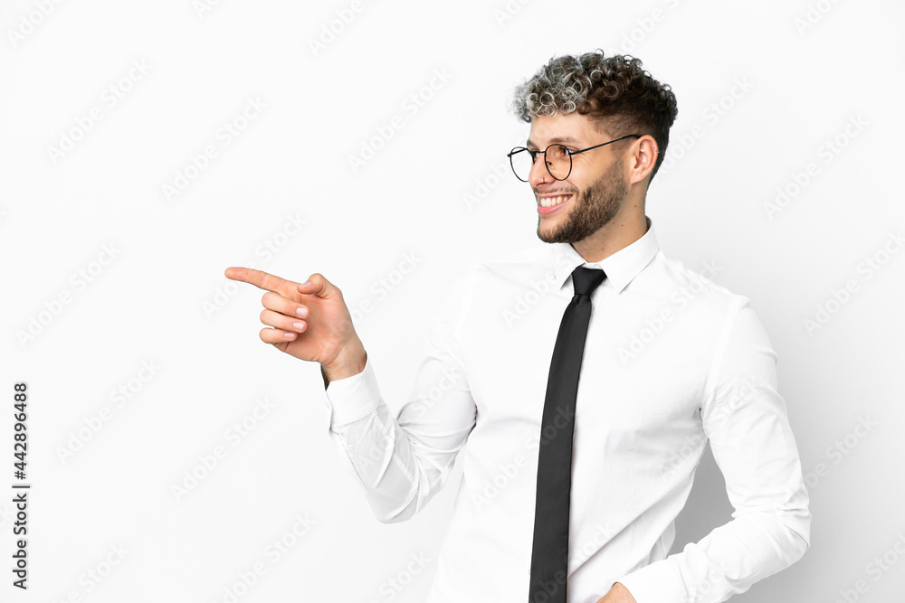Business caucasian man isolated on white background pointing finger to the side and presenting a product Business caucasian man isolated on white background pointing finger to the side and presenting a product