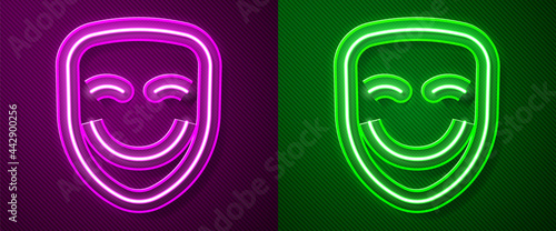 Glowing neon line Comedy theatrical mask icon isolated on purple and green background. Vector