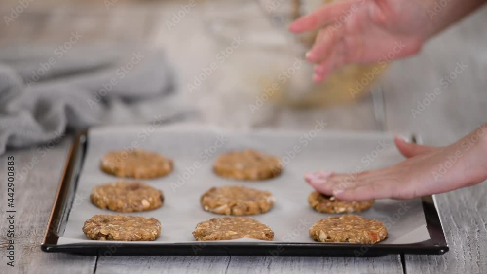 The formation of delicious oatmeal cookies, on a baking sheet The formation of delicious oatmeal cookies, on a baking sheet