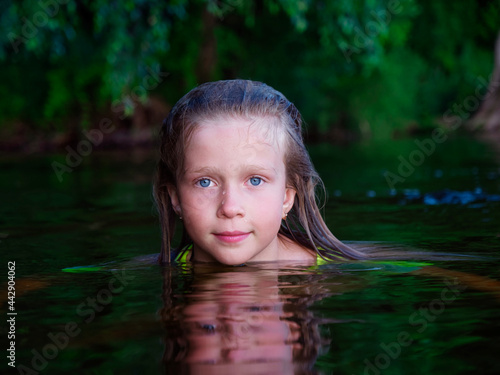 Fototapeta Naklejka Na Ścianę i Meble -  girl mermaid in the water with wet hair