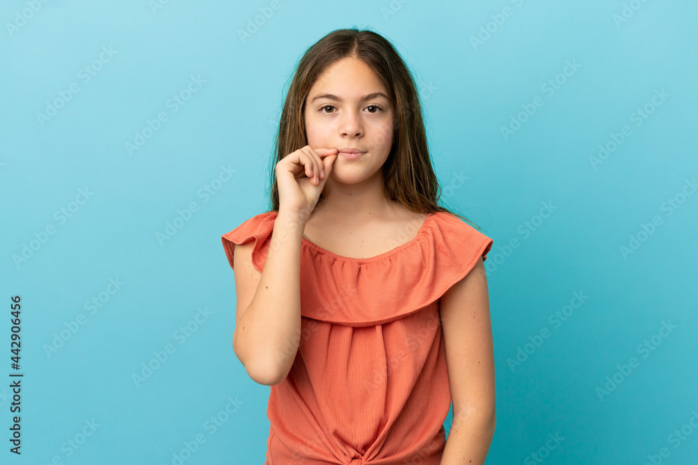 Little caucasian girl isolated on blue background showing a sign of silence gesture Little caucasian girl isolated on blue background showing a sign of silence gesture