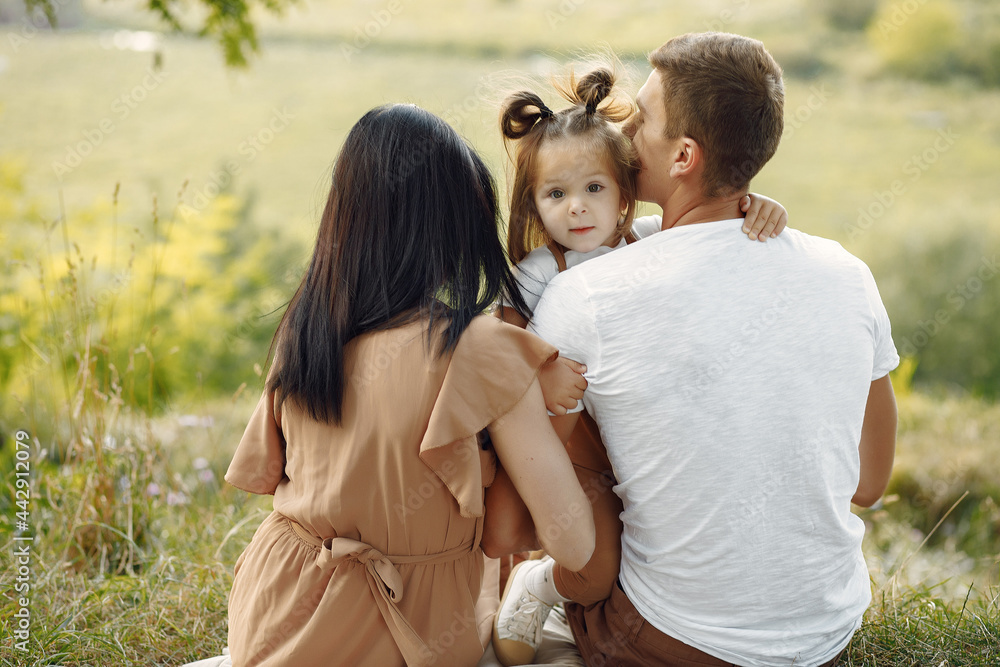 Cute family playing in a autumn field Cute family playing in a autumn field