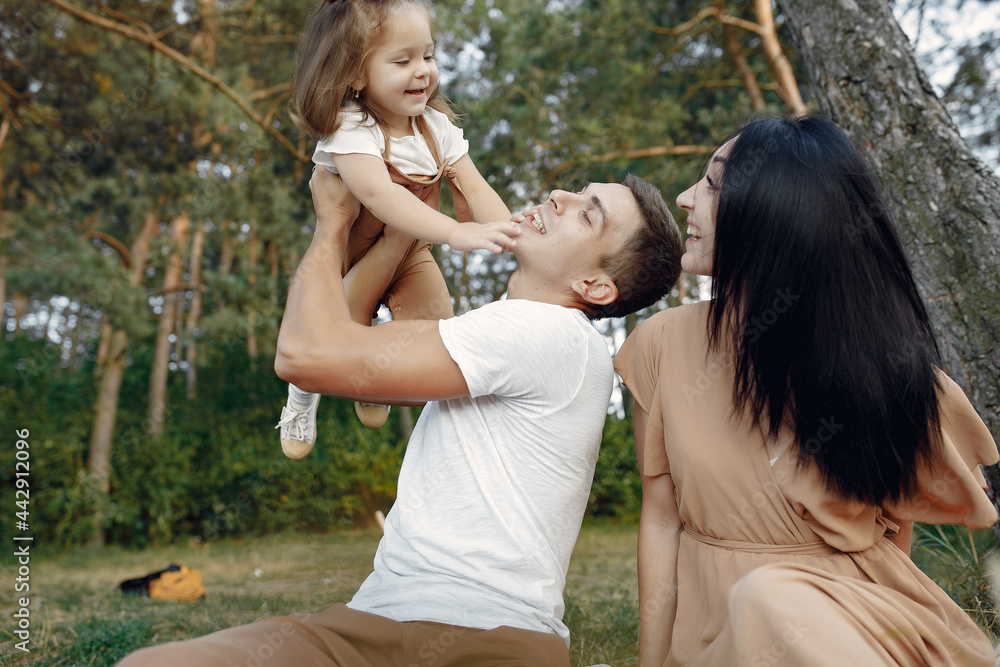 Fototapeta premium Cute family playing in a autumn field
